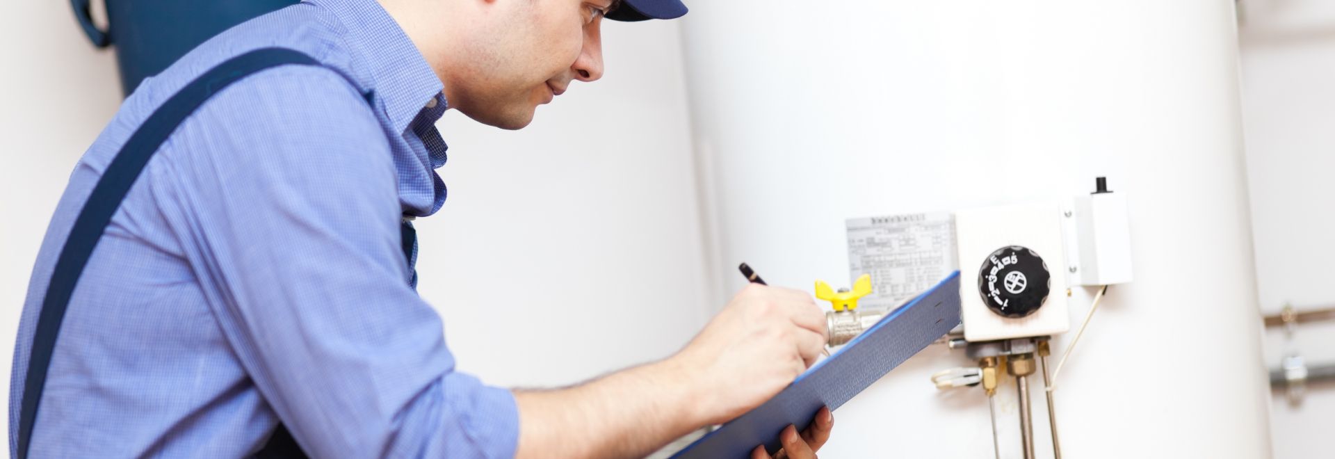 Technician Inspecting Water Heater