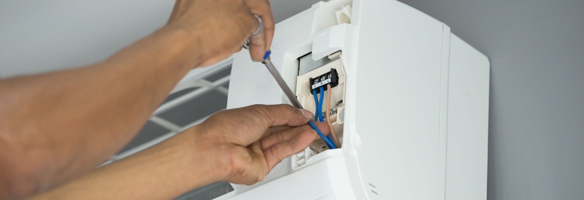 Man fixing a heat pump